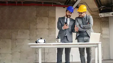 Site managers in hard hats planning flooring supply and installation in Sydney